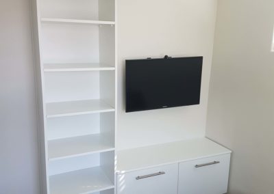 custom tv unit with cupboard draws and 5 shelves