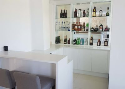 custom bar install with wine fridge in white with light grey counters 3