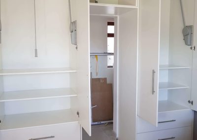 custom built in cupboards with shelves with custom rails