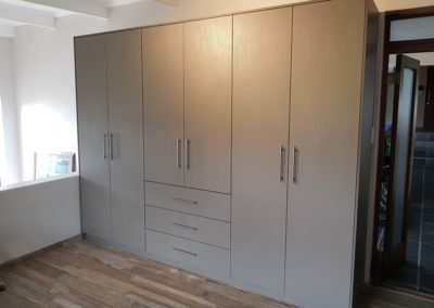 custom built in cupboards with grey doors 3