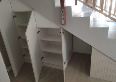 custom cabinetry solution built and installed under a staircase 2