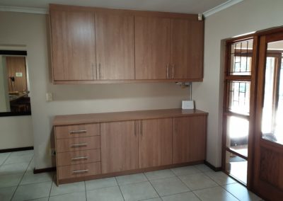 Light brown cupboard installation featuring 4 side draws