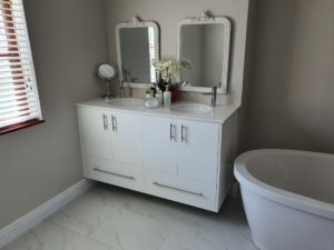 custom gloss white vanity with two sinks
