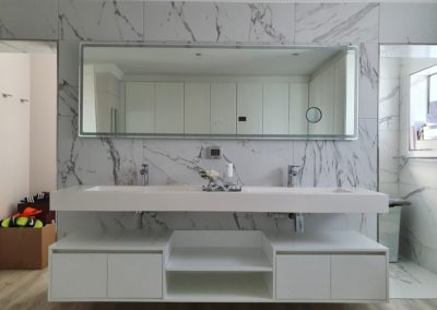 Bathroom cabinetry installation in gloss white