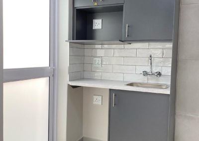 Small kitchenette with grey doors