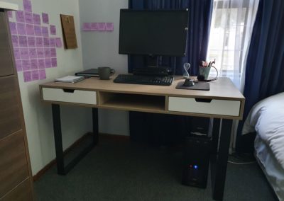 custom office desk built with black steel legs