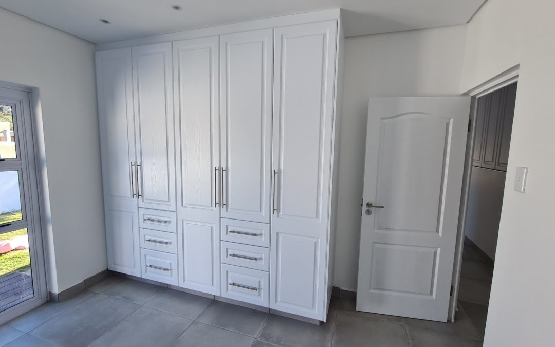 White cupboards with drawers